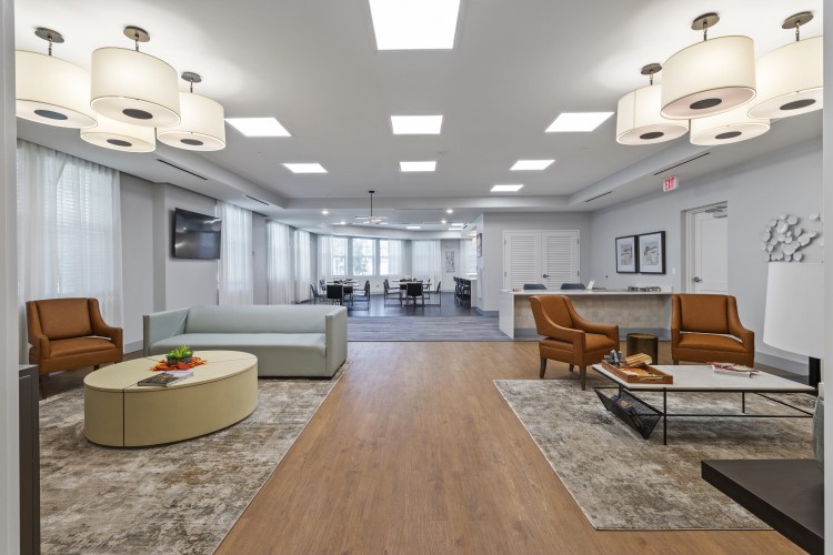 Interior view of Amaryliis Park Place Apartments community room ktichen and dining area